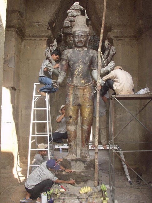 Restoration work on the figure of Vishnu.