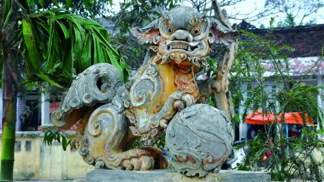 Dragon guarding the bridge to the Dinh or village hall.