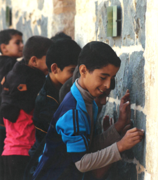 Syrian refugee children in the Irbid Archaeological Museum